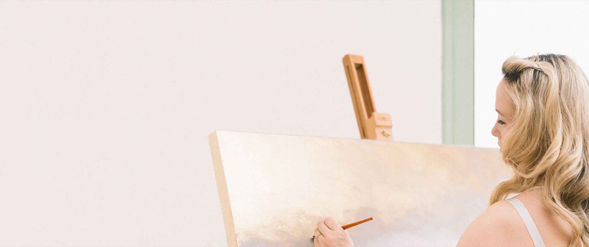 Kiki painting at an easel